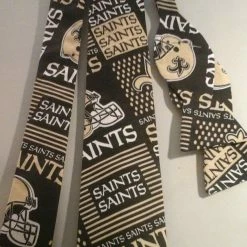 Tidal Cool Neckties, Vests, Pocket Squares And Cummerbunds NFL New Orleans Saints Face Mask Or Neckties In Bow Tie, Skinny Tie, And Standard Tie Styles, Kids Or Adult Sizes