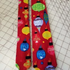 Tidal Cool Feliz Navidad Christmas Neckties In Bow Tie, Skinny Tie, And Standard Tie Styles, Kids Or Adult Sizes Neckties, Vests, Pocket Squares And Cummerbunds