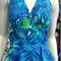 Tidal Cool Hawaiian Print Pinup Halter In Blue And Green Floral Print And Peplum Ruffle