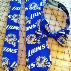 Tidal Cool Detroit Lions NFL Neckties In Bow Tie, Skinny Tie, And Standard Tie Styles, Kids Or Adult Sizes Neckties, Vests, Pocket Squares And Cummerbunds
